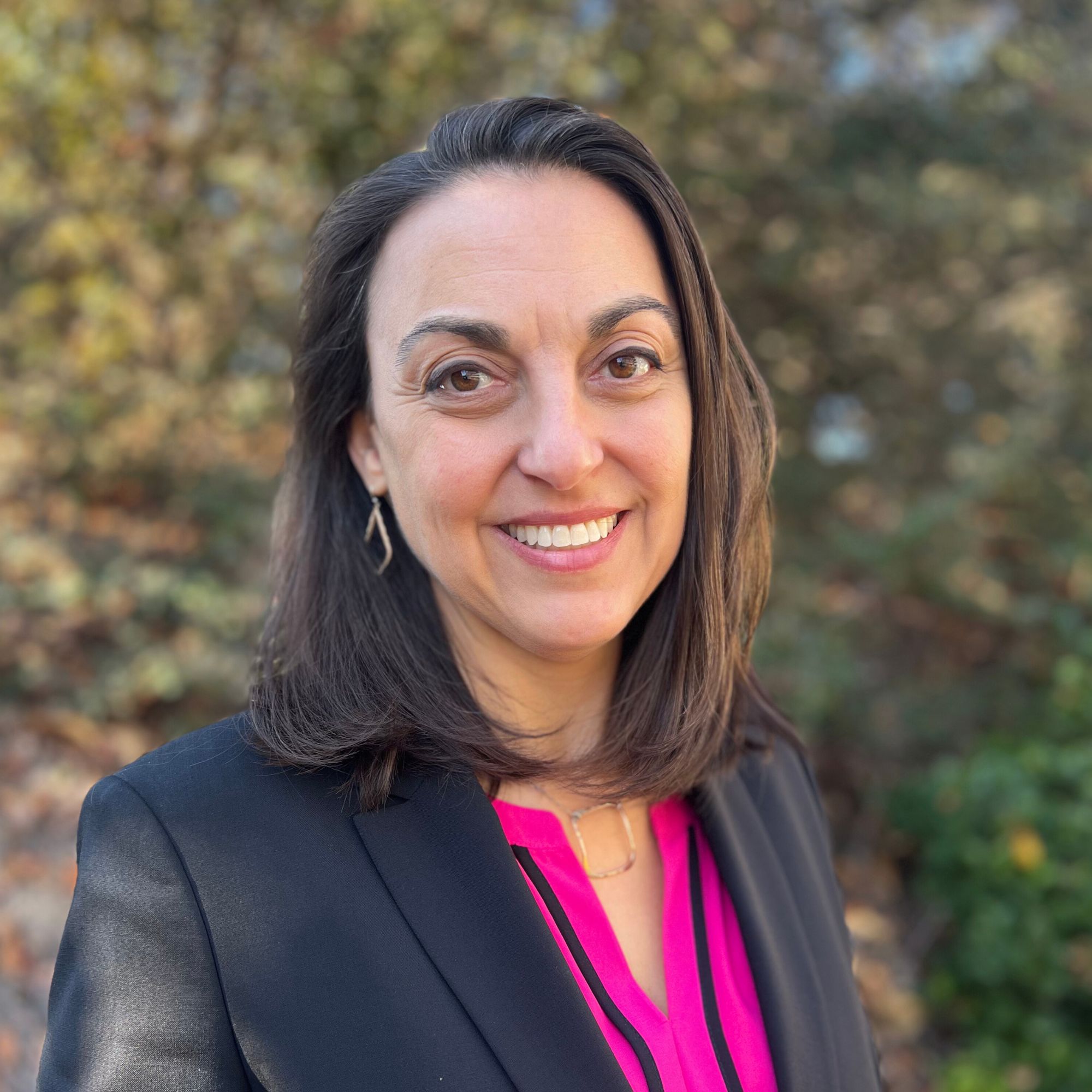 A headshot photo of Andrea Malik Roe, President, Chief FInancial Officer, and Co-Founder of CRH Healthcare